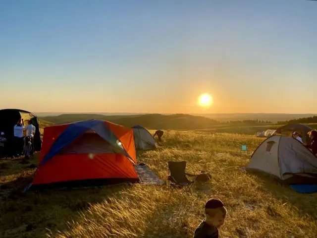 Sunset over camping tents in Yatir